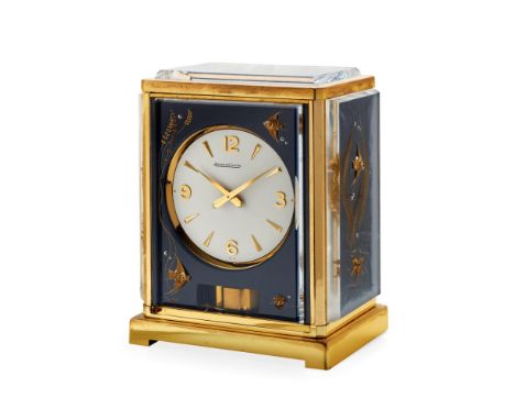  JAEGER-LECOULTRE ATMOS “MARINA", 60S Case: gilded brass and lucite panels, decorated with tridimensional figures of scalar f