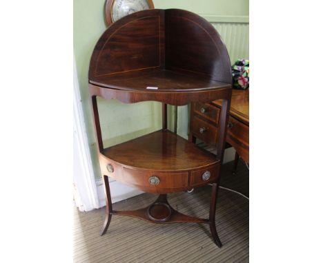 A GEORGIAN MAHOGANY CORNER WASHSTAND with tall plain splashback, having associated cut solid upper shelf covering the origina