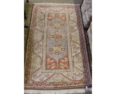 A GEOMETRIC PATTERN WOVEN WOOLLEN CARPET 