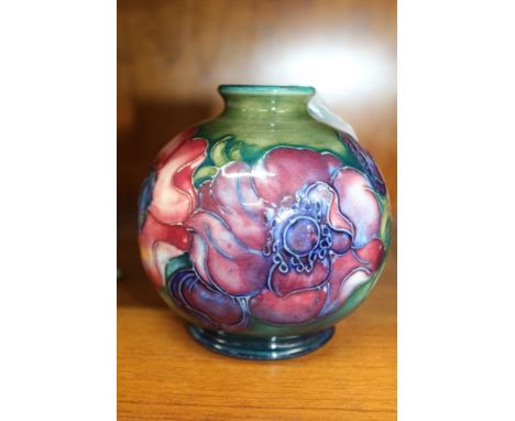 A MOORCROFT CERAMIC VASE of globular form, tube lined and hand painted anemone decoration, impressed factory mark to base, 10