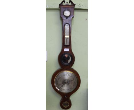 A 19TH CENTURY MAHOGANY WHEEL BAROMETER, the case with Swan neck pediment, silvered original main dial, thermometer &amp; hyd