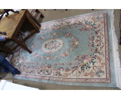 A ROOM SIZE BLUE GROUND CHINESE WASHED WOOL FLOOR CARPET, with floral decoration 