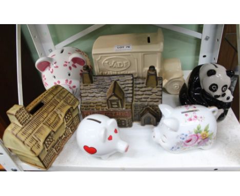 A SHELF FULL OF MONEY BOXES VARIOUS 