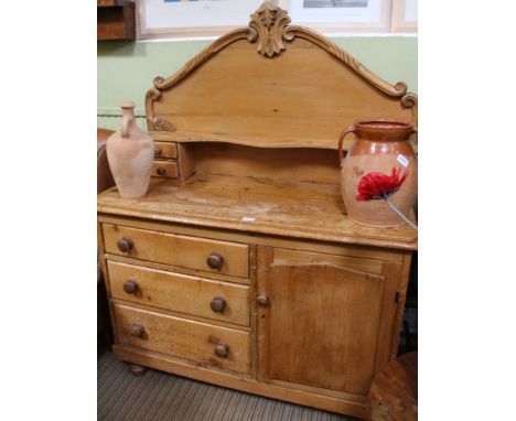 A 19TH CENTURY PINE SIDEBOARD UNIT having associated high back top with display shelf, base unit with three drawer &amp; plai