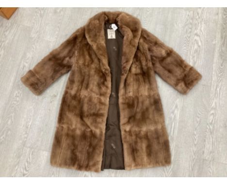 A LADIES 3/4 LENGTH FUR COAT BY M FLETCHER LTD SOUTHPORT SIZE 12 APPROX