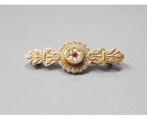 FOLIATE 1 3/4 BROOCH IN 9CT GOLD WITH BULLS EYE CENTRE AND AMETHYST CENTRE SURROUNDED BY 6 SEED PEARLS LOCKET TO REVERSE MAKE