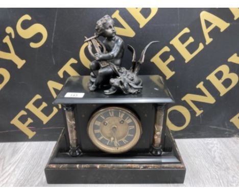 A VICTORIAN SLATE AND MARBLE MANTLE CLOCK WITH PUTTI AND DRAGON TO TOP 37CM HIGH 32.5CM WIDE