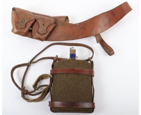 WW1 British Water Bottle, being a blue enamel bottle with khaki felt covering. Complete with the brown leather harness and st