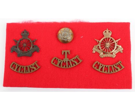Grouping of WW1 Badges of the Army Cyclist Corps, including two variations of cap badge, pair of brass CYCLIST shoulder title