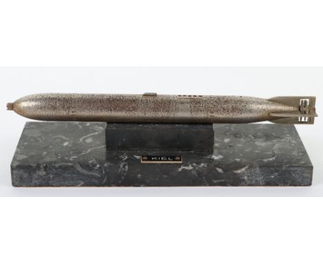 Desk Model of a WW2 German Torpedo, plated white metal model mounted onto a heavy marble base with plaque “KIEL”. Paper cover
