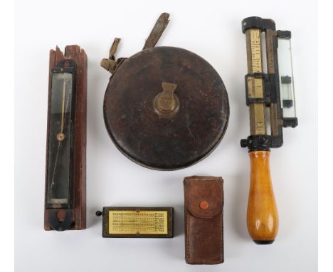 Grouping of WW1 Period Rangefinder Instruments, including a 1916 dated tape measure in circular leather cover with brass piec