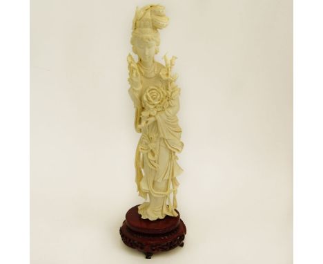 Mid 20th Century Chinese Carved Ivory Guanyin Figure on Carved Wood Base. Unsigned. Good condition. Measures 10-3/4" H, 2-3/4