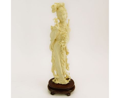 Mid 20th Century Chinese Carved Ivory Guanyin Figure on Carved Wood Base. Unsigned. Good condition. Measures 8-1/4" H, 2-1/4"