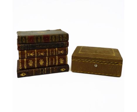 Vintage Tantalus Set in the form of a stack of books. Includes a small decanter and 4 glasses. Chips  to stopper plug. Wear. 