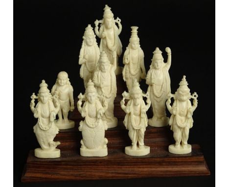 Ten (10) Indian Carved Ivory Deity Figures on Stepped Wood Base. Unsigned. Good Condition or Better. Each figure Measures 2-3