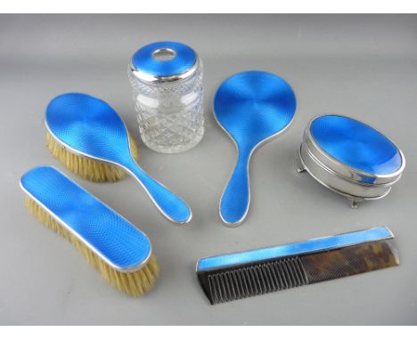 A GOOD SIX PIECE SILVER & BLUE ENAMEL DRESSING TABLE SET comprising two brushes, a dressing mirror, a comb, a silver and enam