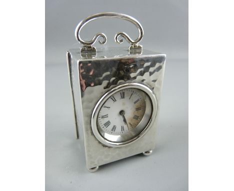 A SILVER CASED MINUET CARRIAGE CLOCK, London 1905, French brass movement with captive winder, 8.75 cms high handle up