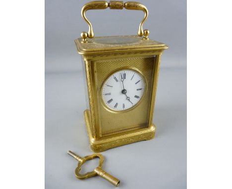 V R BREVETE, PARIS GILT BRASS CARRIAGE CLOCK, chased decorated case with engine turned dial mask and gong strike movement, tr