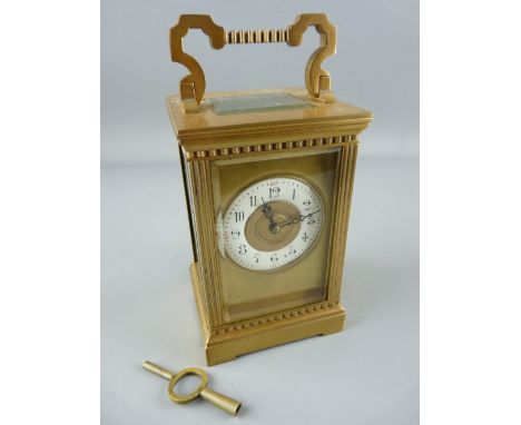 A FRENCH ARCHITECTURAL BRASS CASED CARRIAGE CLOCK with gong striking movement, Arabic set dial with gilt centre and surround,