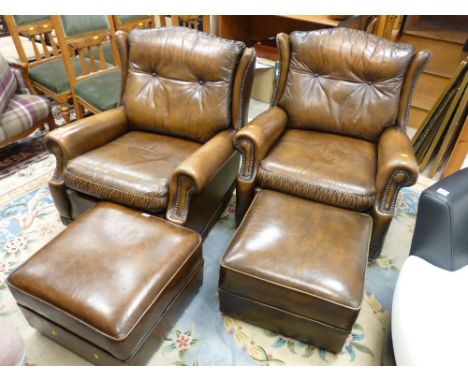A PAIR OF VINTAGE PEGASUS LEATHER ARMCHAIRS, 84 cms high, 79 cms wide, 85 cms deep overall