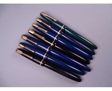 Six Vintage Parker Slimfold fountain pens (two black, four blue) and one Junior, all with 14k nibs