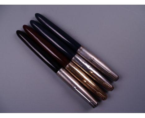 Four Vintage Parker 51 fountain pens (one black, two blue, one brown)
