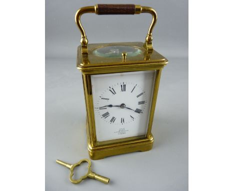 A DENT, LONDON BRASS FACED CARRIAGE CLOCK with Paris movement, backplate marked 'E G L', no. 5009, 17 cms high handle up, wit