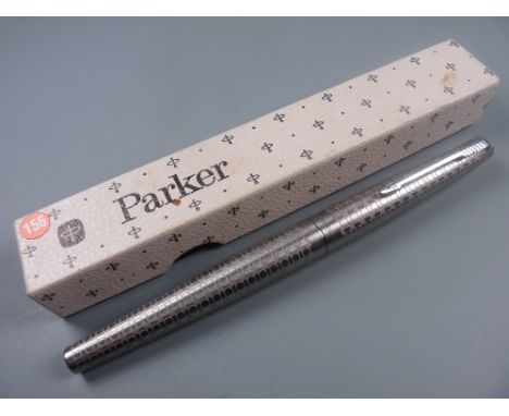 Vintage (1981 date code) stainless steel Parker 45 Harlequin Circlet fountain pen with steel nib and chrome trim (in box)