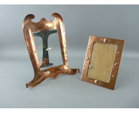TWO ARTS & CRAFTS COPPER PORTRAIT FRAMES, one stamped 'Newlyn' with front shell decoration, 17 x 12 cms approximately, the ot