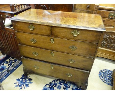 AN ANTIQUE OAK CHEST of two short over three long drawers on corner bracket feet, 93 cms high, 93 cms wide, 43 cms deep
