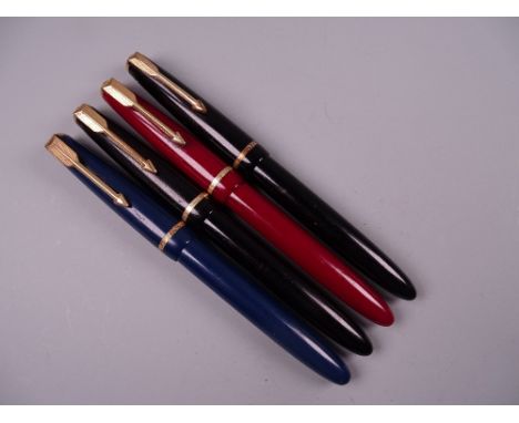 Four Vintage Parker Slimfold fountain pens (two black, one blue, one red), all with 14k nibs