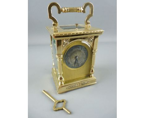 R & CO, PARIS BRASS CASED CARRIAGE CLOCK with repeating gong strike mechanism and arched front and side glass, the silvered d
