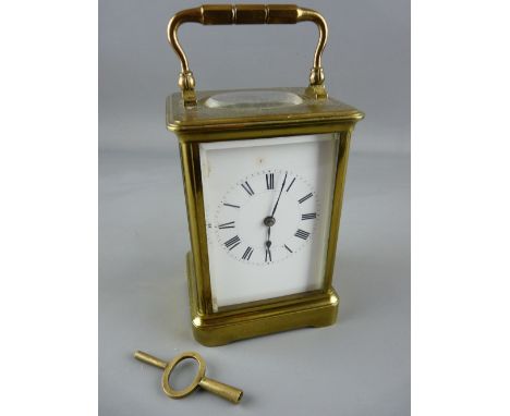 A FRENCH BRASS CASED CARRIAGE CLOCK BY HENRI JACOT, trademark stamp to the backplate, no. 4260, 17 cms high handle up, with k