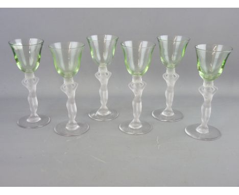 A SET OF SIX ART DECO DRINKING GLASSES with uranium bowls and frosted nude figurine stems, 16 cms high