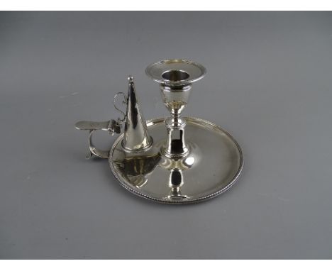 A GEORGE III SILVER CHAMBER STICK & SNUFFER with removable sconce, London 1785, 8.4 troy ozs, 14 cms diameter, indistinct mak