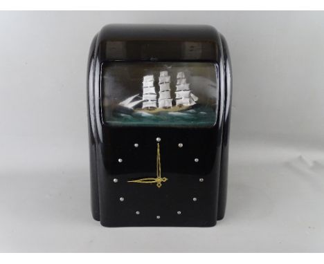 A VITASCOPE BLACK BAKELITE AUTOMATON CLOCK with threemaster ship