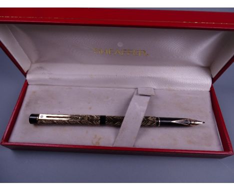 Vintage slimline model Black and Gold Sheaffer Targa fountain pen with feather pattern and 23-carat gold electroplated trim, 