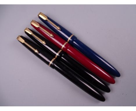 Four Vintage Parker Slimfold fountain pens (two black, one blue, one red), all with 14k nibs
