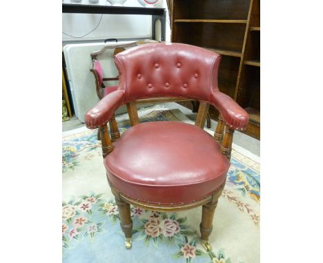 A VINTAGE OAK OFFICE ARMCHAIR with button back upholstery, 84 cms high, 63.5 cms wide, 70 cms deep overall