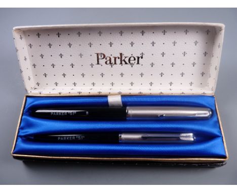 Vintage black Parker 51 fountain pen and pencil set with Lustraloy cap and chrome plated clip, chalk marks on barrels, in ori