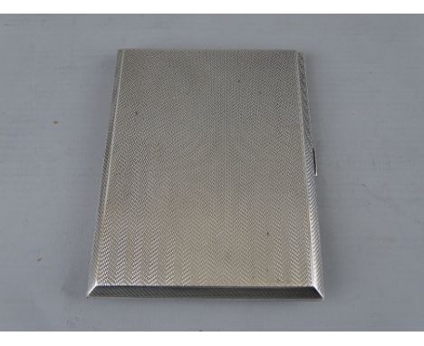 A RECTANGULAR SILVER CIGARETTE CASE with engine turned decoration, Birmingham 1931, 5 troy ozs, interior inscription 'W O R, 