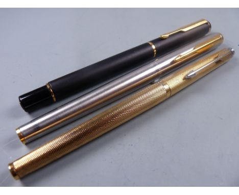 Modern matt black Parker Rialto ballpoint pen with gold plated trim, an early 90's stainless steel Parker 95 Flighter fountai