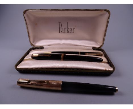 Vintage black Parker 61 fountain pen with engine-turned RG cap (jewel missing on cap) and a Vintage black Parker Duofold foun