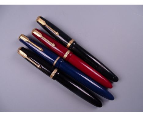 Four Vintage Parker Duofold fountain pens (two black, one blue, one red) all with 14k nibs