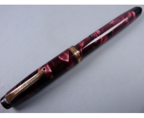 Vintage red marble Parker Challenger Junior fountain pen with button filler and gold plated trim (brassing to cap band), 14ct