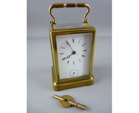 A BRASS CASED CARRIAGE CLOCK stamped 'A D' to backplate, with unusual full view platform top, Roman numeral set white dial wi