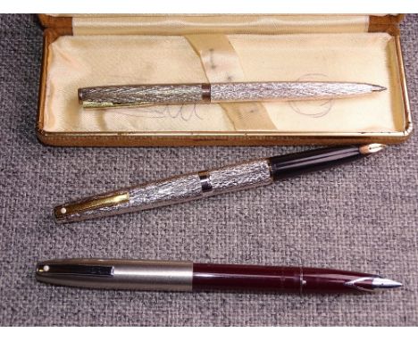 Vintage Burgundy Sheaffer 440 (Imperial) fountain pen with brushed stainless steel cap, and V-shaped stainless steel inlaid n