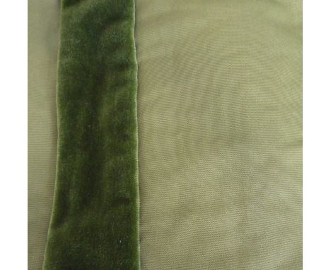 A pair of curtains in a heavy green twill-type fabric embellished with strip of green velvet, thick woollen thermal lining un