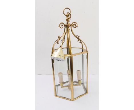 A hexagonal gilt-brass four-light ceiling-hanging lantern (55.5cm high)
