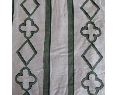 A pair of green and cream curtains edged with a broad band of green fabric, triple pinch pleat heading, thermal lining under 